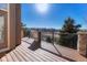 Sunny deck with stone accents and black metal railings, overlooking the neighborhood at 3125 Starling Ct, Castle Rock, CO 80109