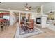 Bright dining area with a cozy fireplace, stylish table, and seamless access to the kitchen at 3125 Starling Ct, Castle Rock, CO 80109
