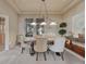 Elegant dining room with tray ceiling, chandelier, and tasteful decor for formal gatherings at 3125 Starling Ct, Castle Rock, CO 80109