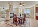 Dining room with a fireplace, large windows, and a ceiling fan at 3125 Starling Ct, Castle Rock, CO 80109
