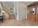 Grand entryway with beautiful wood door, tile flooring, and staircase leading to the upper level at 3125 Starling Ct, Castle Rock, CO 80109