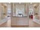 Open-concept interior showcasing tile floors, decorative columns, and natural light at 3125 Starling Ct, Castle Rock, CO 80109