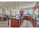 Bright and airy kitchen features a large island with cooktop, and ample counter space at 3125 Starling Ct, Castle Rock, CO 80109