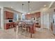 Spacious kitchen with a center island, cherry wood cabinets, and modern appliances at 3125 Starling Ct, Castle Rock, CO 80109