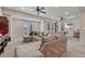 Living room features a sectional couch, plush carpet, and a view of the pool table at 3125 Starling Ct, Castle Rock, CO 80109