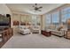 Comfortable living room featuring neutral tones, decorative artwork, and large windows for ample light at 3125 Starling Ct, Castle Rock, CO 80109