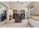 Spacious home office with built-in cabinets, desk, and a comfortable seating area at 3125 Starling Ct, Castle Rock, CO 80109