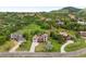 Scenic view of a hillside community, featuring a manicured lawn and mature trees at 5979 Willow Springs Dr, Morrison, CO 80465