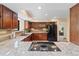 Spacious kitchen featuring granite countertops, sleek appliances, and ample cabinetry, perfect for culinary enthusiasts at 5979 Willow Springs Dr, Morrison, CO 80465