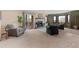 Cozy living room with a fireplace, plush seating, and ample natural light at 5979 Willow Springs Dr, Morrison, CO 80465