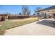 Spacious backyard featuring a covered patio and mature trees at 11744 W 71St Pl, Arvada, CO 80004