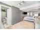 A spacious main bedroom leads to a modern bathroom with sleek fixtures, adding to the room's appeal at 11744 W 71St Pl, Arvada, CO 80004