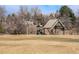 Outdoor playground with a slide, swings, and a shaded picnic area in a grassy park setting at 11744 W 71St Pl, Arvada, CO 80004