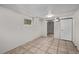 Finished basement featuring tile flooring and doorways to additional rooms at 4051 S Cherokee St, Englewood, CO 80110