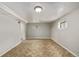 Open basement area with herringbone vinyl flooring at 4051 S Cherokee St, Englewood, CO 80110