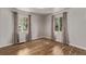 Empty bedroom with hardwood floors, neutral paint and curtains at 4051 S Cherokee St, Englewood, CO 80110