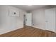Neutral bedroom with hardwood floors and closet space at 4051 S Cherokee St, Englewood, CO 80110