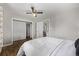 Bedroom features hardwood floors and a bright ceiling fan at 4051 S Cherokee St, Englewood, CO 80110