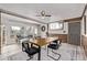 Bright dining area with modern furniture and large windows, creating a welcoming atmosphere for gatherings at 4051 S Cherokee St, Englewood, CO 80110