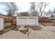 Two-car detached garage with a small railed deck above the garage at 4051 S Cherokee St, Englewood, CO 80110