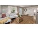 Bright living room with hardwood floors, white sofa and decorative accents, creating a cozy atmosphere at 4051 S Cherokee St, Englewood, CO 80110
