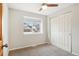 Bright bedroom showcases a window with neighborhood views, and a closet at 2106 Kay St, Longmont, CO 80501