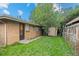 The backyard features a well-maintained lawn, a shed, and a secure fence at 4787 Carr St, Wheat Ridge, CO 80033