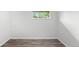 This bedroom has wood-look floors, a window, and neutral colored walls at 4787 Carr St, Wheat Ridge, CO 80033