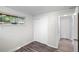 Bedroom has a large window, and new wood-look flooring at 4787 Carr St, Wheat Ridge, CO 80033