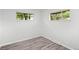 The bedrooms feature wood-look flooring and a pair of windows at 4787 Carr St, Wheat Ridge, CO 80033