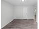 Living room with wood-look flooring, decorative wall panel, and fresh paint at 4787 Carr St, Wheat Ridge, CO 80033