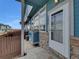 Townhouse exterior showcases a private patio area, perfect for outdoor relaxation and entertaining at 12032 Leyden St, Brighton, CO 80602