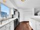 Bright kitchen with white cabinets, stainless steel appliances, and a view of outdoors at 12032 Leyden St, Brighton, CO 80602