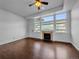 Clean, bright living room with a brick fireplace and large windows at 12032 Leyden St, Brighton, CO 80602