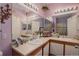 A full bathroom with a dual sink vanity, decorative butterfly wall art, and neutral countertop at 19049 E Warren Dr # 105, Aurora, CO 80013