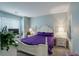 Cozy bedroom with carpet, natural light, and an accent wall at 19049 E Warren Dr # 105, Aurora, CO 80013