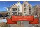 Inviting condo building with stone accents, balconies, and well-maintained landscaping, offering a $5,000 seller concession at 19049 E Warren Dr # 105, Aurora, CO 80013