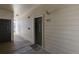 Apartment building hallway with dark-colored doors and light walls at 19049 E Warren Dr # 105, Aurora, CO 80013