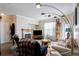 Bright living room with a fireplace, area rug, and natural light at 19049 E Warren Dr # 105, Aurora, CO 80013