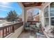 Covered patio with seating area, offering a peaceful outdoor space at 19049 E Warren Dr # 105, Aurora, CO 80013