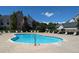 Relaxing community pool with plenty of lounge chairs for residents to enjoy on a sunny day at 19049 E Warren Dr # 105, Aurora, CO 80013