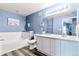 Inviting bathroom with dual sinks, a soaking tub, and modern finishes at 9311 Amison Cir # 201, Parker, CO 80134