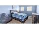 Relaxing bedroom featuring a comfortable beanbag chair, natural light and neutral toned carpet at 9311 Amison Cir # 201, Parker, CO 80134