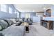 Spacious living room with vaulted ceilings and a cozy gray sectional sofa, creating a comfortable gathering space at 9311 Amison Cir # 201, Parker, CO 80134
