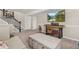 Finished basement with cozy seating area, staircase, and television; ideal for Gathering time and recreation at 1658 Glade Gulch Rd, Castle Rock, CO 80104