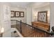 Warm upstairs hallway area boasting lovely wood flooring, decor, and soft, natural lighting at 1658 Glade Gulch Rd, Castle Rock, CO 80104