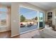Bright living room showcasing a sliding glass door leading to an outdoor living space at 1658 Glade Gulch Rd, Castle Rock, CO 80104