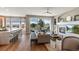 Inviting living room featuring a fireplace, large windows, and an open floor plan at 1658 Glade Gulch Rd, Castle Rock, CO 80104