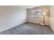 Neutral bedroom with carpet flooring and a window for natural light at 2209 S Flanders St, Aurora, CO 80013