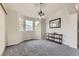 Dining area features bright windows, modern chandelier, and elegant finishes at 2209 S Flanders St, Aurora, CO 80013